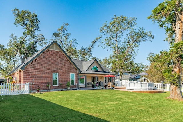 350 Pecan Estates Rd, Angleton, TX 77515 - back of house with brick siding and a patio area