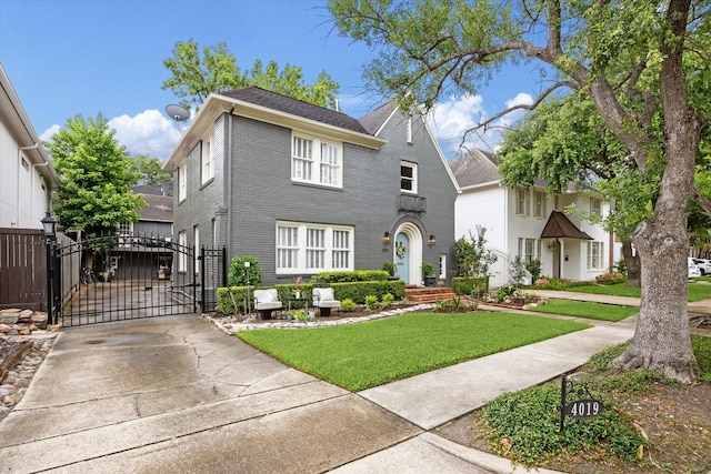 4019 Browning St, Houston, TX 77005 - view of front of home with a gate, a front lawn, brick siding, and driveway