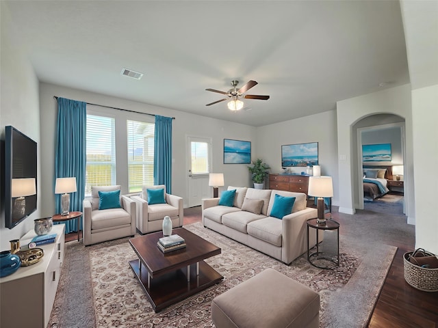 3559 Britton Burrow Way, Richmond, TX 77406 - living area featuring ceiling fan, arched walkways, wood finished floors, and baseboards