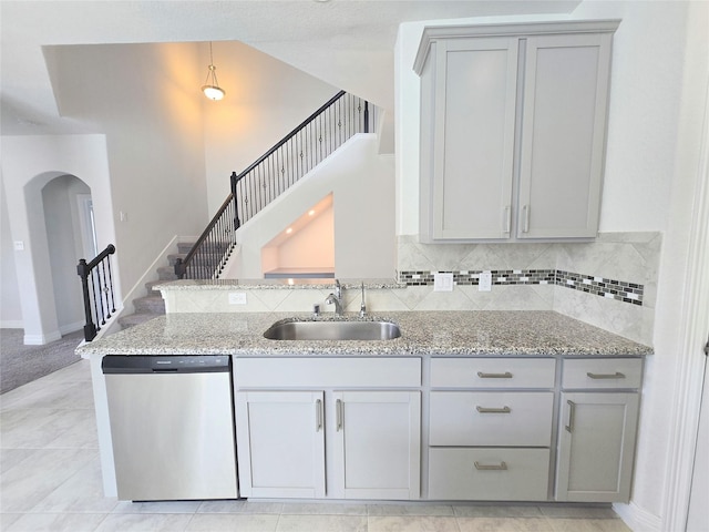 3559 Britton Burrow Way, Richmond, TX 77406 - kitchen featuring dishwasher, gray cabinetry, a sink, and arched walkways