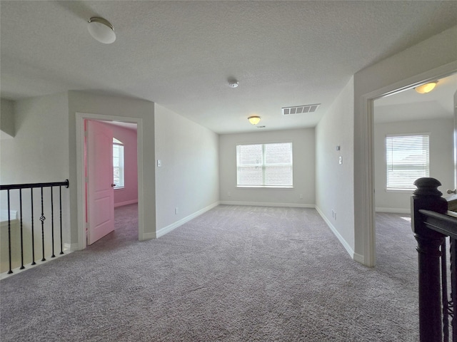 3559 Britton Burrow Way, Richmond, TX 77406 - carpeted spare room featuring healthy amount of natural light, a textured ceiling, and baseboards