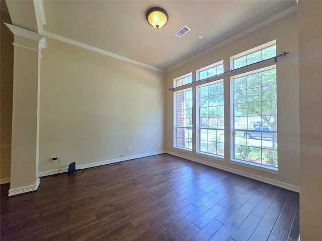 12515 Stoney Creek Dr, Pearland, TX 77584 - unfurnished room featuring plenty of natural light, dark wood-type flooring, baseboards, crown molding, and ornate columns