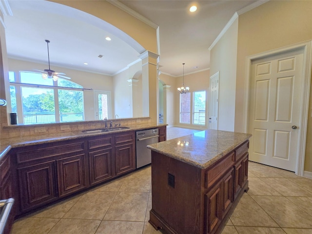 12515 Stoney Creek Dr, Pearland, TX 77584 - kitchen with a sink, dishwasher, a ceiling fan, arched walkways, and light stone counters