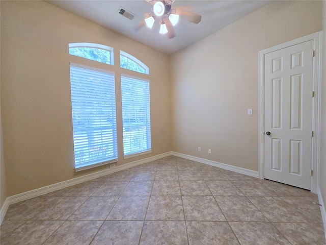 12515 Stoney Creek Dr, Pearland, TX 77584 - spare room featuring a ceiling fan, light tile patterned floors, and baseboards