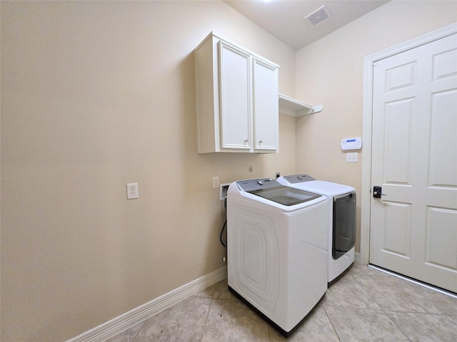 12515 Stoney Creek Dr, Pearland, TX 77584 - washroom featuring cabinet space, washer and dryer, baseboards, and light tile patterned flooring