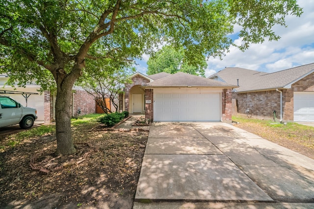 6635 Rusty Ridge Ln, Katy, TX 77449 - ranch-style house with brick siding, driveway, and a garage