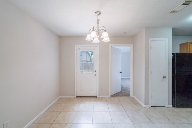 6635 Rusty Ridge Ln, Katy, TX 77449 - entrance foyer with a chandelier, baseboards, and light tile patterned floors
