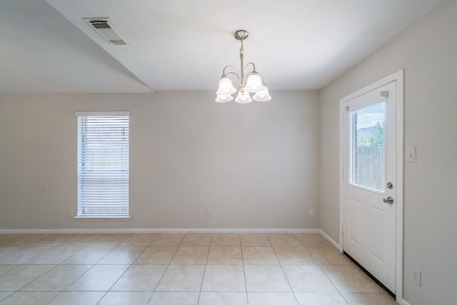6635 Rusty Ridge Ln, Katy, TX 77449 - unfurnished room featuring plenty of natural light, a chandelier, and light tile patterned flooring