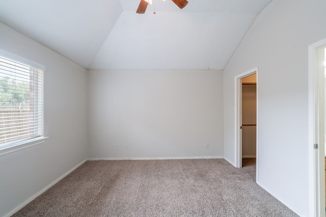 6635 Rusty Ridge Ln, Katy, TX 77449 - unfurnished bedroom featuring vaulted ceiling, a walk in closet, carpet floors, ceiling fan, and a closet