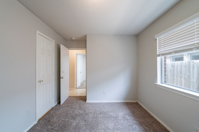 6635 Rusty Ridge Ln, Katy, TX 77449 - empty room with carpet flooring and baseboards