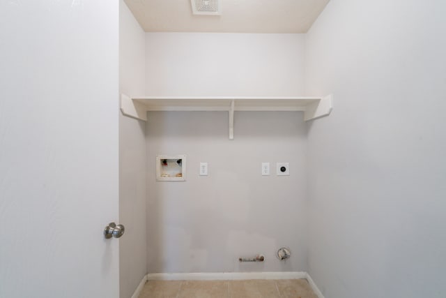 6635 Rusty Ridge Ln, Katy, TX 77449 - laundry area featuring electric dryer hookup, hookup for a washing machine, gas dryer hookup, baseboards, and light tile patterned flooring