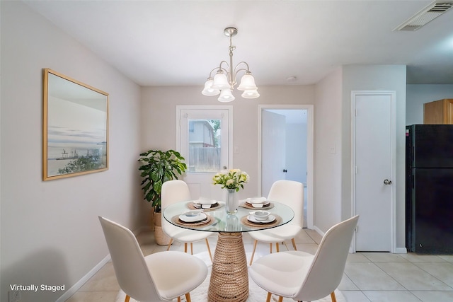 6635 Rusty Ridge Ln, Katy, TX 77449 - dining room with a chandelier, light tile patterned flooring, and baseboards