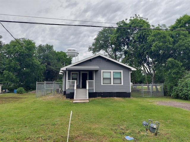 2906 Sledge St, Waller, TX 77484 - view of front facade with a porch, a gate, and crawl space