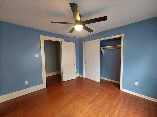 2906 Sledge St, Waller, TX 77484 - unfurnished bedroom with wood finished floors, a closet, baseboards, and a ceiling fan