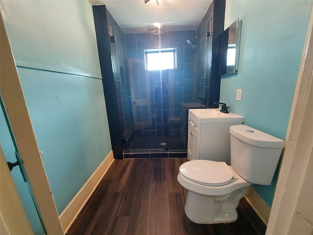 2906 Sledge St, Waller, TX 77484 - full bath featuring toilet, vanity, a shower stall, wood finished floors, and baseboards