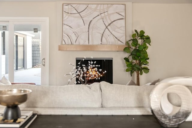2906 Riata Ln, Houston, TX 77043 - living area with a warm lit fireplace