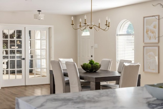 2906 Riata Ln, Houston, TX 77043 - dining room with a chandelier and wood finished floors