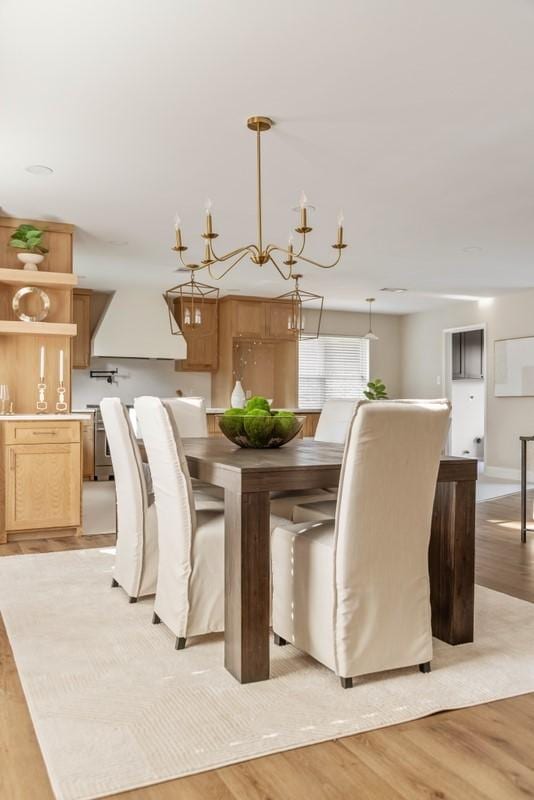 2906 Riata Ln, Houston, TX 77043 - dining room with light wood-type flooring and a chandelier