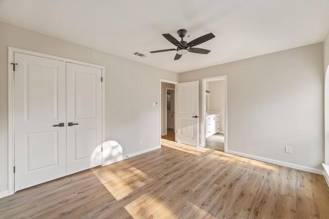 2906 Riata Ln, Houston, TX 77043 - unfurnished bedroom featuring a closet, baseboards, light wood-style flooring, and ceiling fan