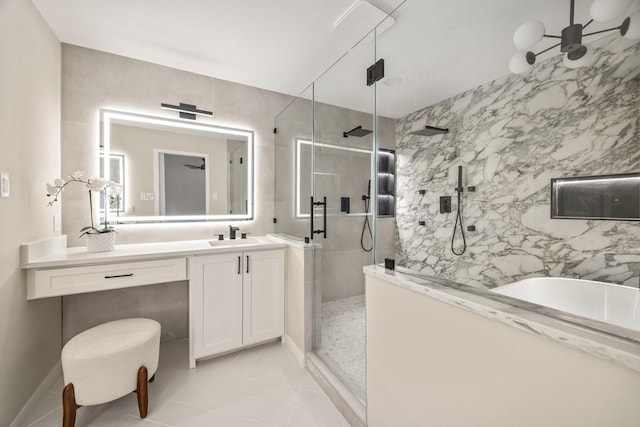 2906 Riata Ln, Houston, TX 77043 - full bathroom with a marble finish shower, vanity, a bath, and tile patterned flooring