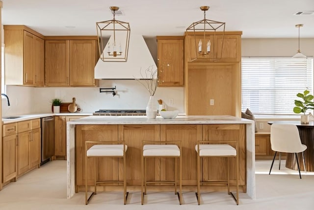 2906 Riata Ln, Houston, TX 77043 - kitchen with a kitchen island, light countertops, pendant lighting, tasteful backsplash, and dishwasher