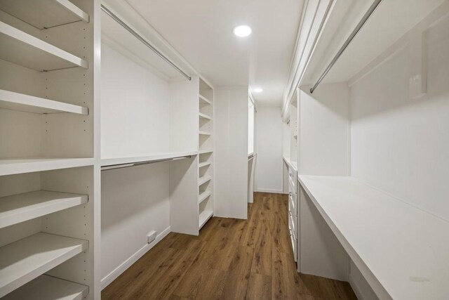 2906 Riata Ln, Houston, TX 77043 - spacious closet featuring wood finished floors