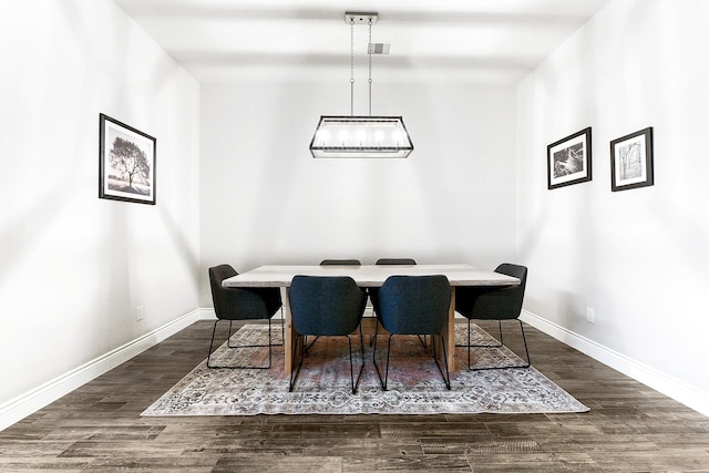 29306 Lovegrass Ct, Katy, TX 77494 - dining area featuring baseboards, wood finished floors, and a chandelier