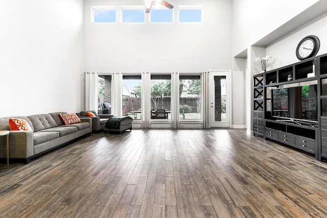 29306 Lovegrass Ct, Katy, TX 77494 - living area with a high ceiling, wood finished floors, ceiling fan, and plenty of natural light