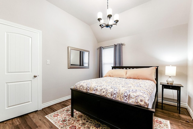 29306 Lovegrass Ct, Katy, TX 77494 - bedroom featuring a chandelier, dark wood finished floors, lofted ceiling, and baseboards