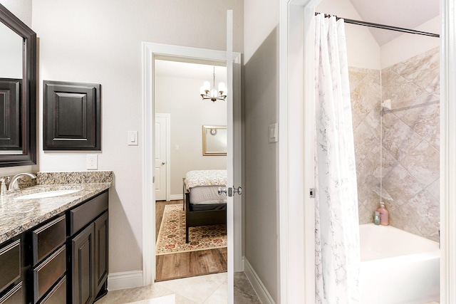 29306 Lovegrass Ct, Katy, TX 77494 - ensuite bathroom with vanity, shower / bath combo, a chandelier, and baseboards