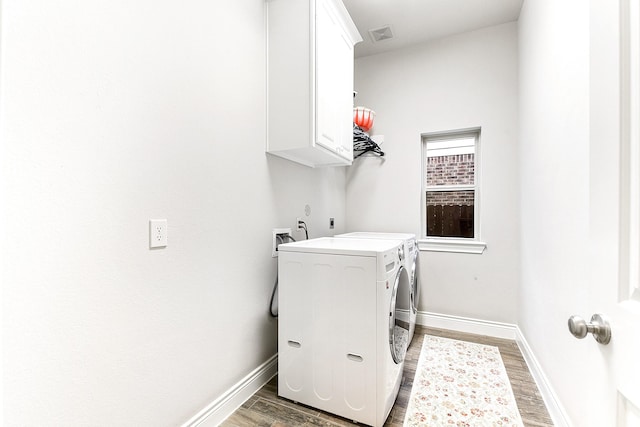 29306 Lovegrass Ct, Katy, TX 77494 - washroom with cabinet space, light wood-type flooring, separate washer and dryer, and baseboards