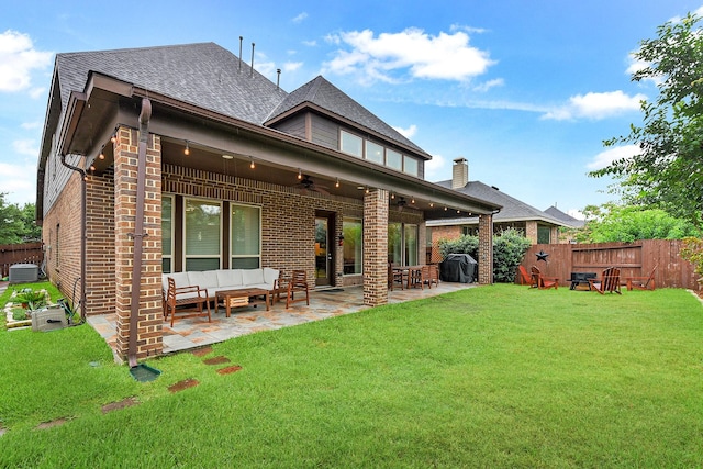 29306 Lovegrass Ct, Katy, TX 77494 - rear view of property with brick siding, ceiling fan, an outdoor hangout area, roof with shingles, and a patio area