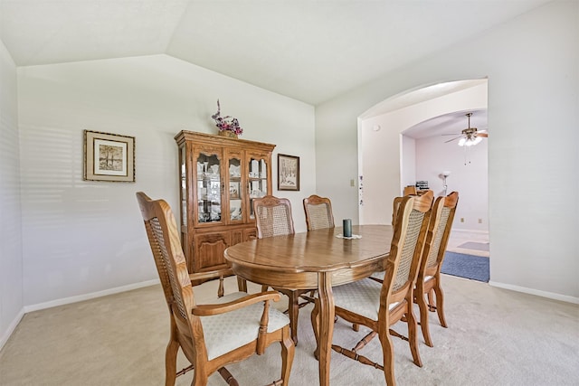 4934 Parkcrest Dr, La Porte, TX 77571 - dining space featuring light carpet, a ceiling fan, arched walkways, vaulted ceiling, and baseboards