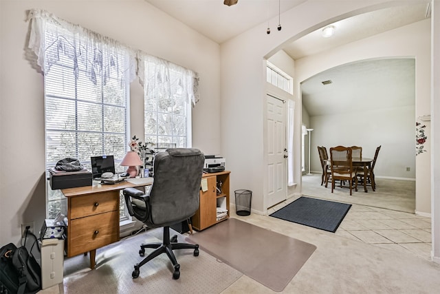 4934 Parkcrest Dr, La Porte, TX 77571 - carpeted home office with arched walkways, tile patterned floors, baseboards, and ceiling fan