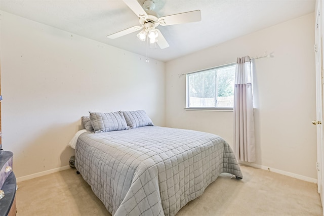 4934 Parkcrest Dr, La Porte, TX 77571 - bedroom featuring light carpet, baseboards, and a ceiling fan