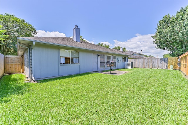 4934 Parkcrest Dr, La Porte, TX 77571 - rear view of house with a chimney and a patio area
