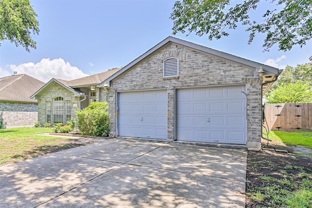 4934 Parkcrest Dr, La Porte, TX 77571 - view of front facade featuring concrete driveway, an attached garage, and stone siding