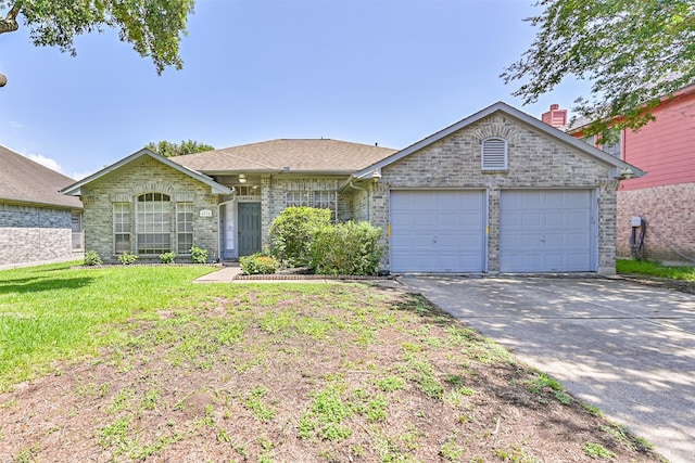 4934 Parkcrest Dr, La Porte, TX 77571 - view of front of home with a garage, concrete driveway, a front yard, and brick siding
