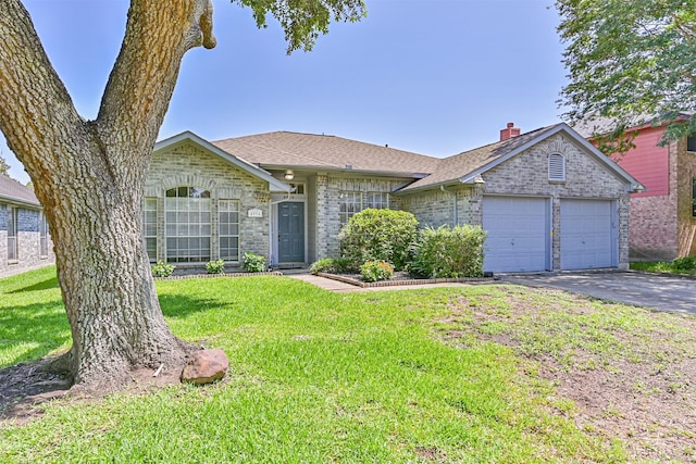 4934 Parkcrest Dr, La Porte, TX 77571 - single story home featuring an attached garage, asphalt driveway, a front lawn, roof with shingles, and brick siding