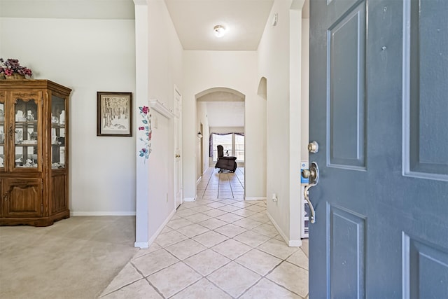 4934 Parkcrest Dr, La Porte, TX 77571 - entrance foyer featuring arched walkways, light tile patterned flooring, and baseboards