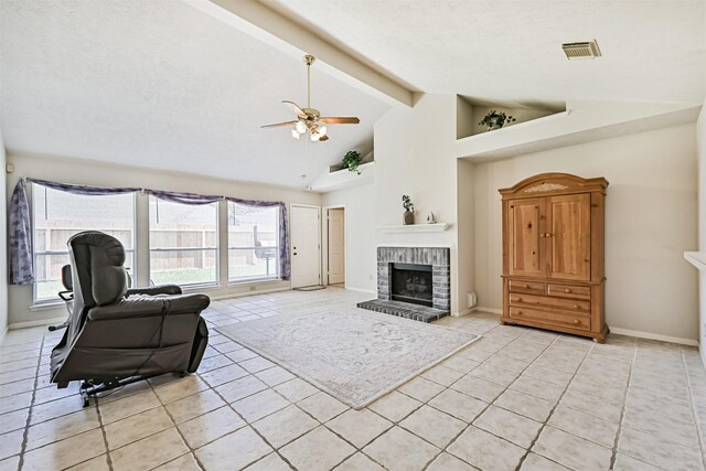 4934 Parkcrest Dr, La Porte, TX 77571 - living room with ceiling fan, light tile patterned floors, a brick fireplace, baseboards, and beam ceiling