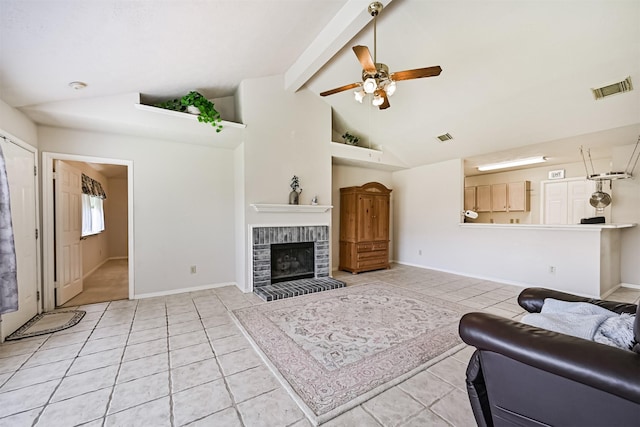 4934 Parkcrest Dr, La Porte, TX 77571 - living room with light tile patterned floors, a ceiling fan, a fireplace, and baseboards