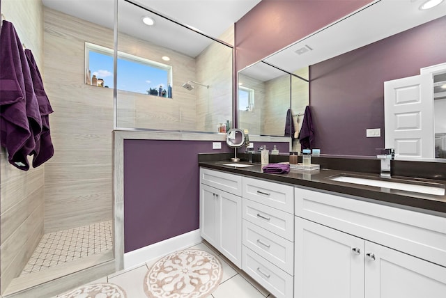2706 Eado Edge Ct, Houston, TX 77020 - bathroom featuring walk in shower, double vanity, tile patterned flooring, and recessed lighting
