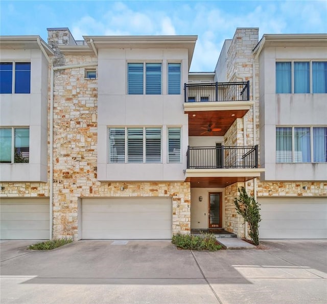 4915 Chenevert St, Houston, TX 77004 - multi unit property featuring a balcony, an attached garage, and stone siding