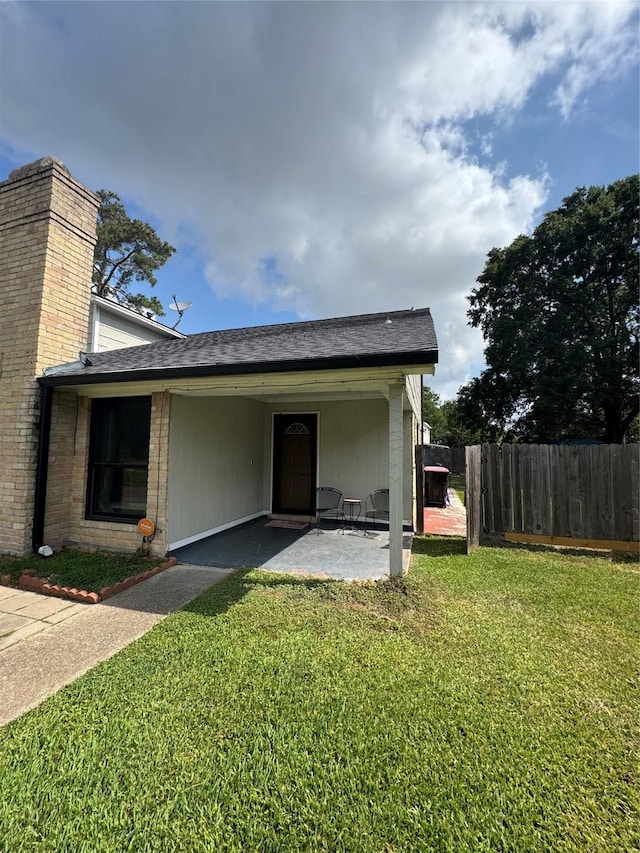 20806 Park Ridge Ct, Katy, TX 77450 - exterior space featuring a chimney, roof with shingles, and a patio