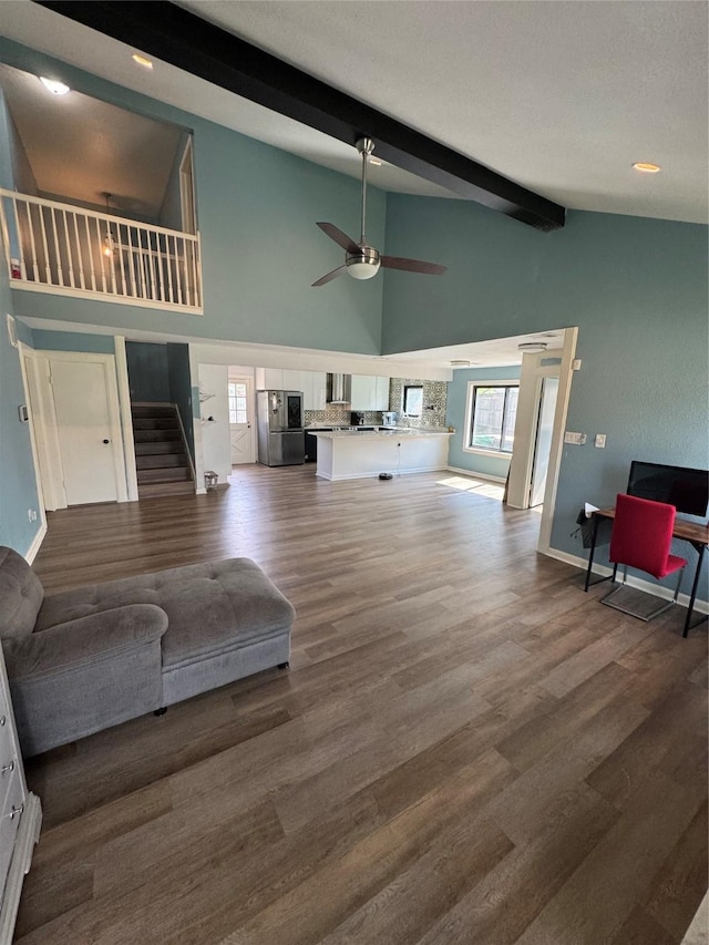 20806 Park Ridge Ct, Katy, TX 77450 - living area with stairway, beamed ceiling, ceiling fan, dark wood-style floors, and baseboards