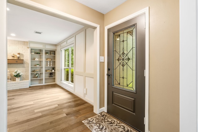 7 E Torch Pine Cir, The Woodlands, TX 77381 - entryway with wood finished floors and baseboards