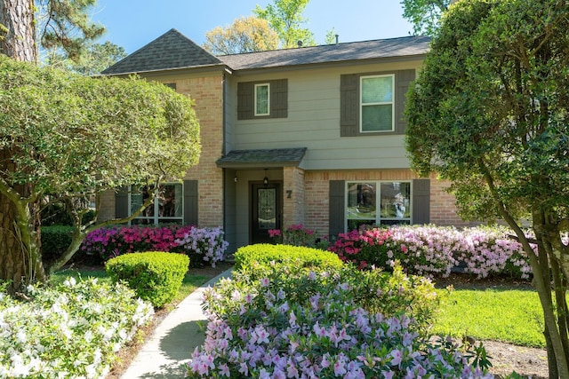7 E Torch Pine Cir, The Woodlands, TX 77381 - view of front of home with brick siding and a shingled roof
