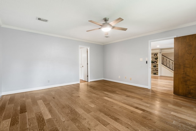 7 E Torch Pine Cir, The Woodlands, TX 77381 - unfurnished room with ceiling fan, wood finished floors, crown molding, stairs, and baseboards