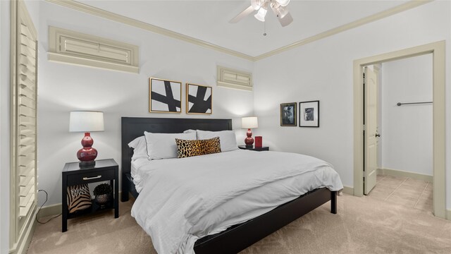 5558 Aspen St, Bellaire, TX 77401 - carpeted bedroom with ornamental molding, baseboards, ceiling fan, and ensuite bath